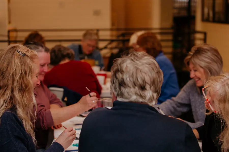 People sitting at a table talking 